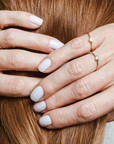 self-love-gold-ring-on-hand.png