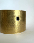 Reptilia Maxima vermeil cuff with black onyx cabochon, angled view.