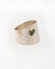 Reptilia silver ring with natural gemstone cabochon, front view on white.