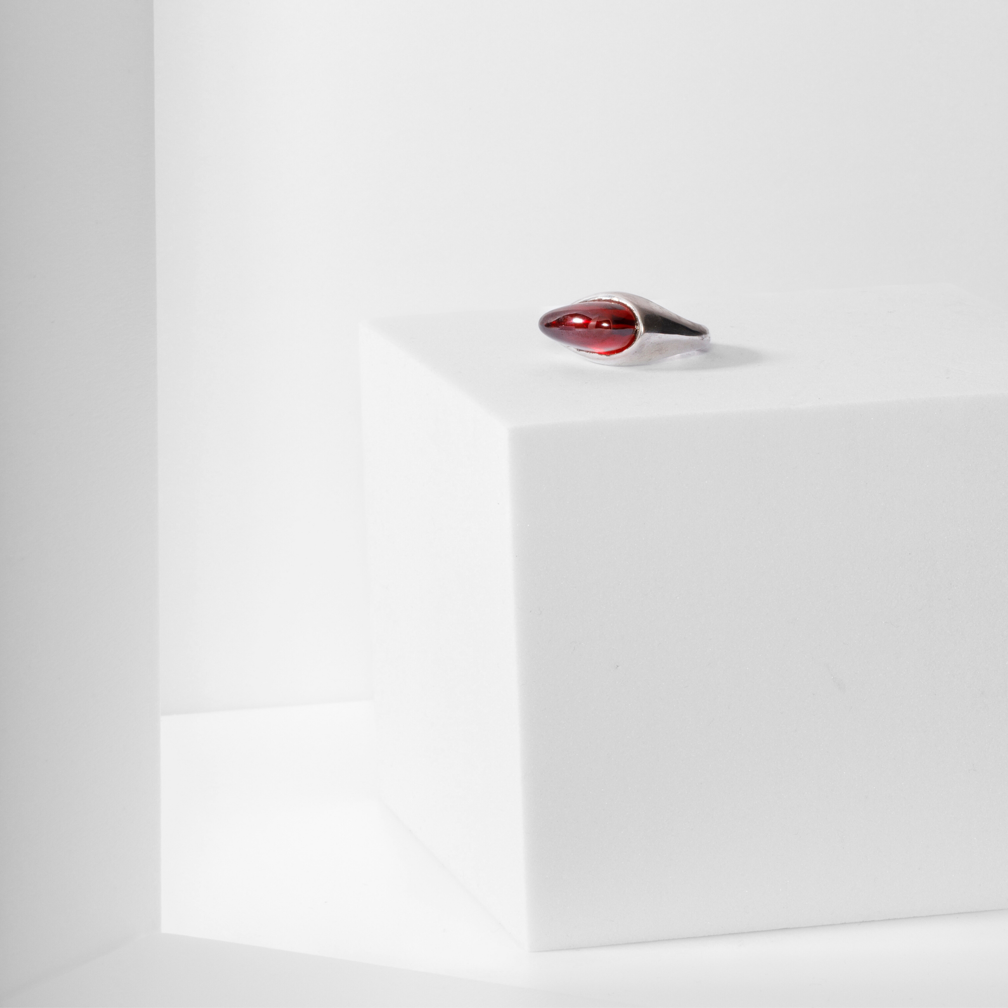 Core Ring in recycled sterling silver with garnet, Carlota Guardia Jewelry, front view.