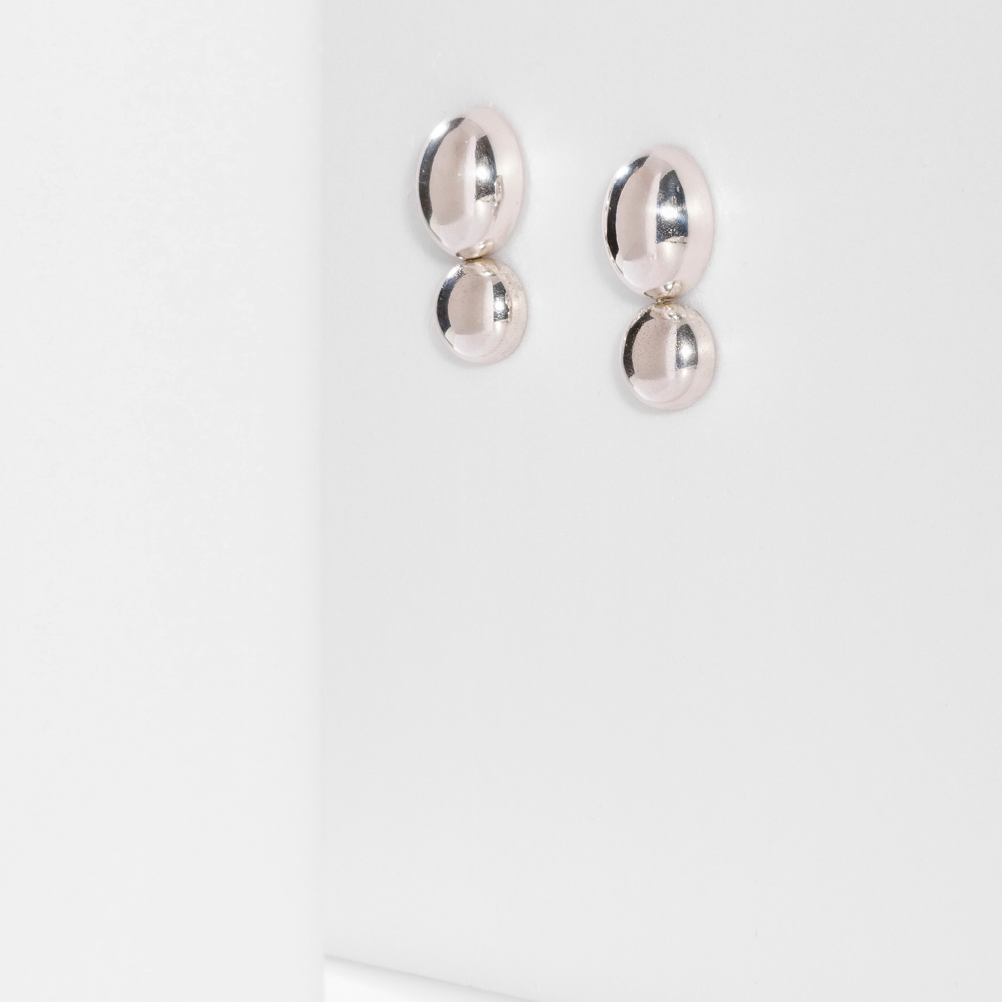 Mirage modular earring in sterling silver with a transformable contemporary design by Carlota Guardia