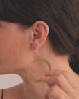 Halo Earrings in vermeil from the Reptilia collection worn by model, showcasing the organic and sculptural form