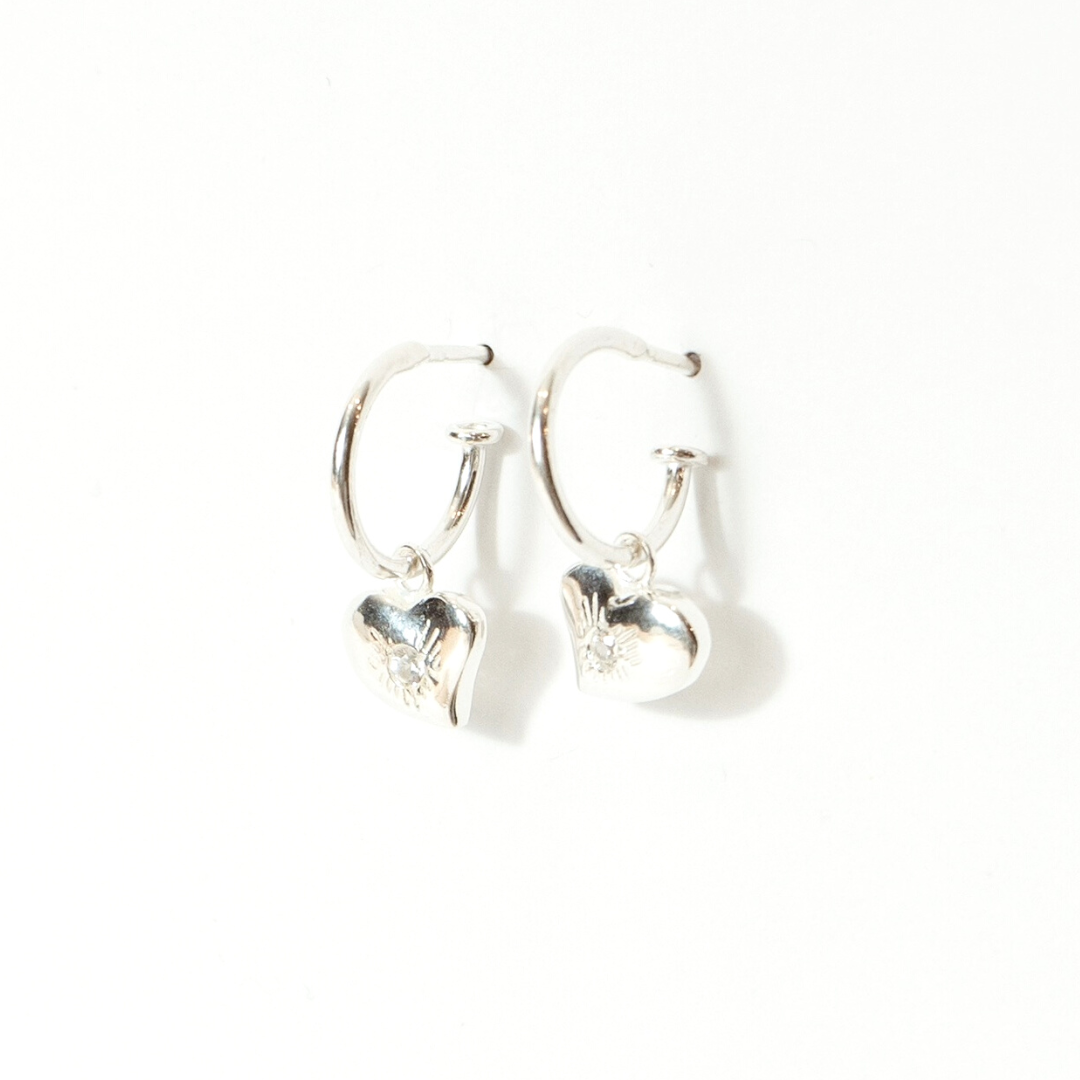 less-amours-bright-silver-earrings-side-view.png